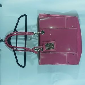 Large Wilson Leather pink tote with animal print interior in good condition.